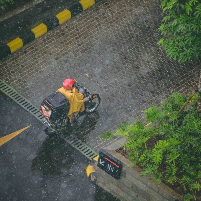 Photo by Mohamed Jamil Latrach person in red helmet riding motorcycle